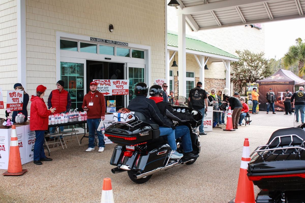 Riders arriving at the Sea Breeze Harley-Davidson toy donation drop-off