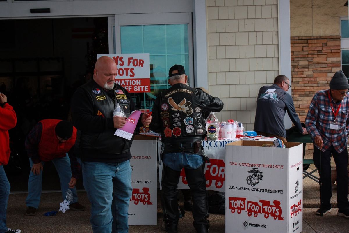 Rolling Thunder bikers at the Toys for Tots donation boxes